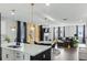 Open-concept living room with island kitchen, fireplace, and hardwood flooring at 1332 Nw Creekside Cir, Atlanta, GA 30318