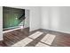 Living room with hardwood floors leading to stairs with custom trim at 1332 Nw Creekside Cir, Atlanta, GA 30318
