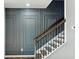 Elegant staircase featuring modern design and stylish wall paneling at 1332 Nw Creekside Cir, Atlanta, GA 30318