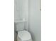 This powder room showcases sleek and modern design elements with a clean white commode and minimalist decorative details at 1332 Nw Creekside Cir, Atlanta, GA 30318