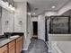 Lovely bathroom with black granite counters, dual sinks, and a walk in shower at 1668 Sabastian Ne Pt, Atlanta, GA 30329