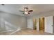 Spacious bedroom features modern ceiling fan, neutral paint, two closets, and two entrances to bathrooms at 1668 Sabastian Ne Pt, Atlanta, GA 30329