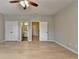 Spacious bedroom features modern ceiling fan, neutral paint, two closets, and two entrances to bathrooms at 1668 Sabastian Ne Pt, Atlanta, GA 30329