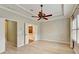 Inviting bedroom features plantation shutters, a ceiling fan, and a tray ceiling at 1668 Sabastian Ne Pt, Atlanta, GA 30329
