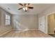 This bedroom features wood floors, neutral paint, and ceiling fan at 1668 Sabastian Ne Pt, Atlanta, GA 30329