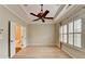 Inviting bedroom features plantation shutters, a ceiling fan, and a tray ceiling at 1668 Sabastian Ne Pt, Atlanta, GA 30329