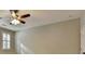 This bedroom includes a ceiling fan and window with shutters at 1668 Sabastian Ne Pt, Atlanta, GA 30329