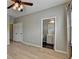 Bedroom with two windows, a ceiling fan, and a connected bathroom at 1668 Sabastian Ne Pt, Atlanta, GA 30329