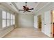 Inviting bedroom features plantation shutters, a ceiling fan, and a tray ceiling at 1668 Sabastian Ne Pt, Atlanta, GA 30329