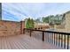 Overhead view of wood deck overlooking brick privacy fence and backyard at 1668 Sabastian Ne Pt, Atlanta, GA 30329