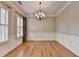 Charming dining room with hardwood floors, wainscoting, and modern lighting at 1668 Sabastian Ne Pt, Atlanta, GA 30329