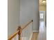 Hallway with wood floors, a staircase with wood railing, and natural light at 1668 Sabastian Ne Pt, Atlanta, GA 30329