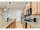 Modern kitchen featuring maple cabinets, stainless steel appliances, and an island at 1668 Sabastian Ne Pt, Atlanta, GA 30329