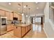 Spacious kitchen with stainless steel appliances and granite island open to living room at 1668 Sabastian Ne Pt, Atlanta, GA 30329