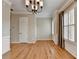 Open-concept living space featuring hardwood floors and modern trim at 1668 Sabastian Ne Pt, Atlanta, GA 30329