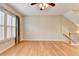 Bright living room with hardwood floors, plantation shutters, and a ceiling fan at 1668 Sabastian Ne Pt, Atlanta, GA 30329