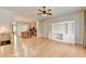 Open-concept living room with hardwood floors connecting to the kitchen and island at 1668 Sabastian Ne Pt, Atlanta, GA 30329
