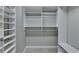 A walk-in closet with custom storage and shelving units at 1668 Sabastian Ne Pt, Atlanta, GA 30329