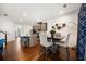 Open-concept layout features a dining area connected to a kitchen with stainless appliances and island seating at 5157 Madeline, Stone Mountain, GA 30083