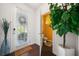Stylish home entryway with modern decor and a glimpse into the powder room at 5157 Madeline, Stone Mountain, GA 30083