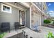 Charming front porch with cozy seating and a welcoming entrance at 5157 Madeline, Stone Mountain, GA 30083