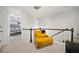 Upstairs hallway with a cozy sitting area and a glimpse into the main bedroom at 5157 Madeline, Stone Mountain, GA 30083