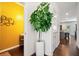Bright hallway featuring modern yellow walls, white trim, and contemporary decor at 5157 Madeline, Stone Mountain, GA 30083