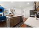 Modern kitchen boasts stainless steel appliances, sleek countertops, and an island with a sink at 5157 Madeline, Stone Mountain, GA 30083