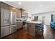 Bright kitchen features stainless steel appliances, modern cabinets, and a cozy breakfast bar with seating at 5157 Madeline, Stone Mountain, GA 30083