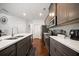 Updated kitchen showcases stainless steel appliances, modern cabinets, and a convenient center island at 5157 Madeline, Stone Mountain, GA 30083