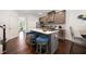 Bright kitchen features stainless steel appliances, modern cabinets, and a central island with barstool seating at 5157 Madeline, Stone Mountain, GA 30083