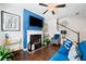 Cozy living room features a fireplace, TV, and comfortable seating, perfect for relaxation at 5157 Madeline, Stone Mountain, GA 30083