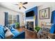 Stylish living room features a fireplace, TV, comfortable seating, and abundant natural light at 5157 Madeline, Stone Mountain, GA 30083