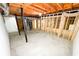 An unfinished basement with exposed beams provides ample potential for renovation at 6092 Leverett Dr, Lithonia, GA 30038