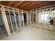 Unfinished basement with framed walls, showing potential for future living space at 6092 Leverett Dr, Lithonia, GA 30038