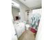 Bathroom featuring a vanity, toilet, and shower with a decorative curtain at 6092 Leverett Dr, Lithonia, GA 30038