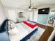 Bright bedroom features a ceiling fan, ensuite bathroom, and a spacious layout at 6092 Leverett Dr, Lithonia, GA 30038