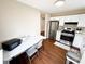 Bright kitchen equipped with stainless steel appliances and eat-in dining area at 6092 Leverett Dr, Lithonia, GA 30038