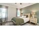 Comfortable bedroom with natural light and a decorative accent wall at 233 Silver Leaf Trce, Douglasville, GA 30134