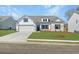 Charming single-story home featuring a two-car garage and a well-manicured lawn at 233 Silver Leaf Trce, Douglasville, GA 30134