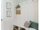 Charming mudroom with decor and storage bench with hooks for organization at 233 Silver Leaf Trce, Douglasville, GA 30134