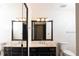 Well-lit bathroom featuring a vanity with granite countertop and a large mirror at 2015 Brookstone Ct, Lithia Springs, GA 30122