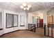 Dining room with a chandelier, large windows, and access to other living spaces at 2015 Brookstone Ct, Lithia Springs, GA 30122