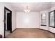 Bright dining room with a chandelier, large windows, and views of the outdoors at 2015 Brookstone Ct, Lithia Springs, GA 30122