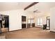 Bright and open living room showcasing vaulted ceilings, ceiling fan, and breakfast bar at 2015 Brookstone Ct, Lithia Springs, GA 30122