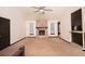 Spacious living room featuring a stone fireplace, high ceilings, and natural light from the windows at 2015 Brookstone Ct, Lithia Springs, GA 30122