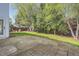 Relaxing backyard area with a concrete patio and lush greenery, perfect for outdoor enjoyment at 3647 Bancroft Main Nw, Kennesaw, GA 30144