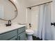 Updated bathroom with modern fixtures, black hardware, and stylish shower curtain at 3647 Bancroft Main Nw, Kennesaw, GA 30144
