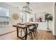 Stylish dining room with modern lighting, hardwood floors, and neutral decor at 3647 Bancroft Main Nw, Kennesaw, GA 30144