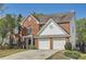 Traditional brick home with a two-car garage and well-maintained front yard at 3647 Bancroft Main Nw, Kennesaw, GA 30144